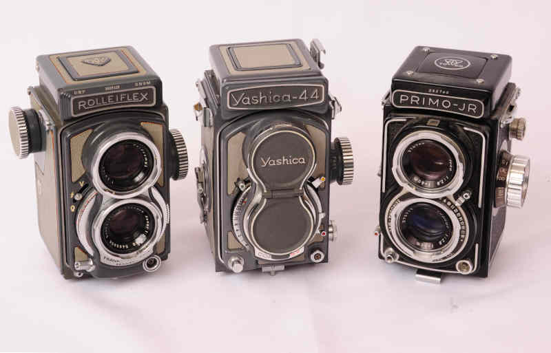 Three 4x4 twin lens reflex cameras